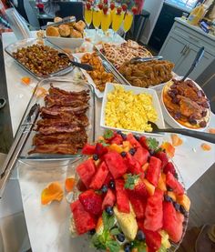 a buffet table filled with lots of food