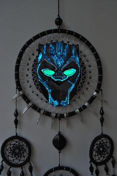 a clock with an image of a black panther on it's face and eyes