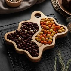 two wooden trays filled with different types of nuts