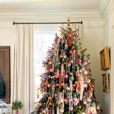 a decorated christmas tree in a living room