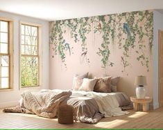 a bedroom with pink walls and floral wallpaper