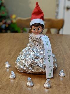 an elf is sitting on top of some tin foil