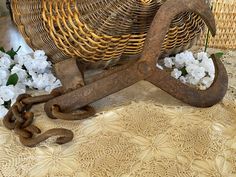 an old wooden sleigh with chains and flowers in the background