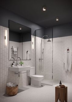 a bathroom with white tile walls and floors