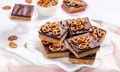 chocolate and pretzel bars on a white plate