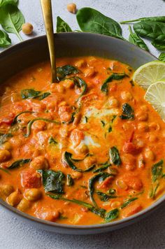 a bowl filled with soup and garnished with spinach