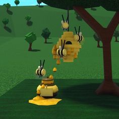 some bees are hanging from a tree in the grass