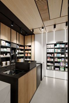 an empty pharmacy room with shelves full of medicine