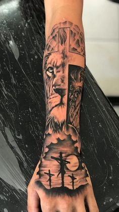 a hand with a cross and lion on it