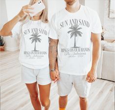 These fun Sun & Sand with Rings on our Hands shirts are the perfect way to celebrate any newly wed couple on their honeymoon! Designed with a fun palm tree they are completely customized and a great way to add some fun to the trip! Simply choose the color and size that you want, then fill out the personalization box with the Couple's name, honeymoon location and the color of ink that you would like for each shirt.   You will receive a customized mockup from me within 24 hours of purchase.  If yo Matching Honeymoon Outfits, Just Married Shirts, Vacation Luxury, Group Trip, Married Shirt, Newly Wed, Beach Honeymoon, Honey Moon, Honeymoon Shirts