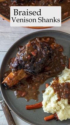 a plate with meat, mashed potatoes and gravy on it