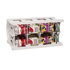 a white spice rack with six cans in it