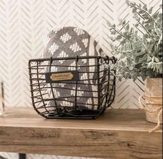 a basket sitting on top of a wooden table