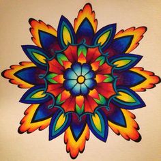 a drawing of a colorful flower on a white wall