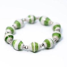 a green and white bracelet with silver beads