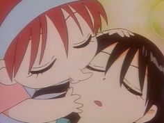 an anime character kissing another person with their eyes closed