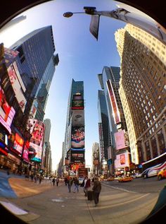 a fish eye view of people walking in the city