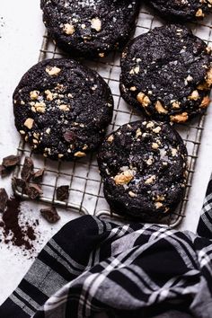 chocolate cookies with walnuts on a cooling rack