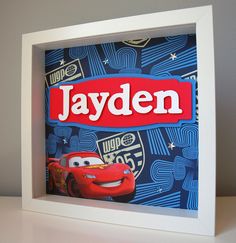 an image of the name jayden in front of a cartoon character with cars on it