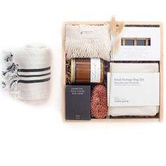 an assortment of items in a wooden box on a white background with black and white stripes