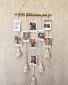 a wall hanging with pictures and tassels on it