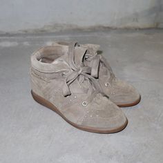 Beautiful khaki green Bobby sneakers by Isabel Marant.  Great vintage condition.  Size 39 but run small! Best fit 38-38.5. Khaki High-top Sneakers For Streetwear With Round Toe, Vintage Suede Sneakers With Round Toe, Vintage Brown High-top Sneakers With Round Toe, Vintage Beige High-top Sneakers, Khaki Lace-up High-top Sneakers With Rubber Sole, Vintage Beige Lace-up Sneakers, Isabella Marant Shoes, Isabel Marant Bobby Sneakers, Isabel Marant Wedge Sneakers