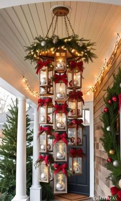 an outdoor christmas decoration with lights and ornaments hanging from the side of a house on a porch