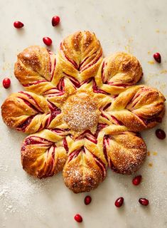 cranberry danish pastries with powdered sugar and pomegranates