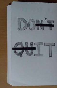 a piece of paper with the words don't quit written in black on it