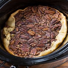 the pecan pie is ready to be cooked in the crock pot