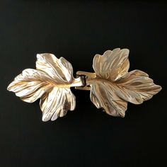 Vintage 1980 Jeannie Bouchever 2-Piece Belt Buckle Gold-Tone Ivy Leaves 2-piece buckle that should fit up to 1.25” belt. Measurements are shown in photos. Condition Good. Minor wear and tear consistent with normal use and age. Light finish loss that’s visible in last photo. No major flaws to note. Returns I am no longer accepting returns for vintage clothing and accessories. Please refer to measurements to ensure a good fit. If you are unsure of your size (or the type who will fuss over a small Gold Belt Dress, Gold Metal Belt, 80s Disco, Ivy Leaves, Gold Belt, Gold Belts, Ivy Leaf, Gold Leaves, Metal Belt