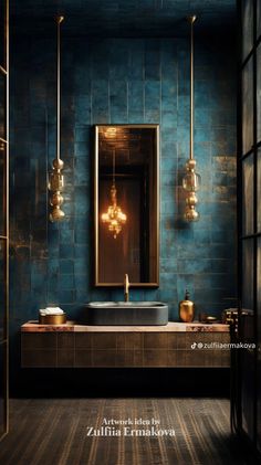 a bathroom with blue walls and gold fixtures on the sink, along with two hanging lights