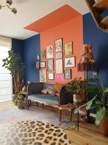 a living room filled with furniture and lots of plants