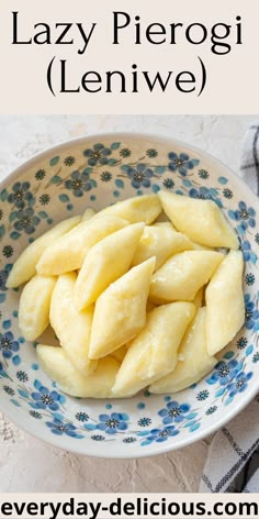 a bowl filled with sliced bananas on top of a blue and white plate next to a napkin