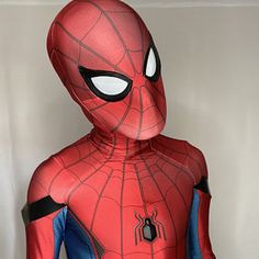 a spider - man costume is displayed on a mannequin's head and shoulders