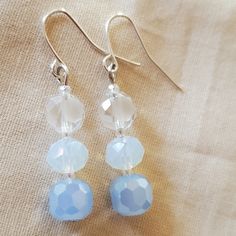 Sparkly Earrings Made With Frosted White Glass Beads, Glass Beads Made To Look Opalescent And Similar To Moonstone, And Soft Blue Glass Beads. Earrings Glass Beads, Glass Beaded Earrings, Elegant Blue Faceted Beads Earrings, Blue Round Bead Glass Earrings, Blue Crystal Earrings With Faceted Beads, Chip Bead Jewelry, Blue Glass Earrings With Round Beads, Blue Glass Earrings With Dangling Beads, Blue Beaded Earrings