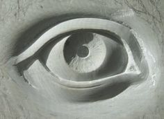 a close up of a metal object with an eye