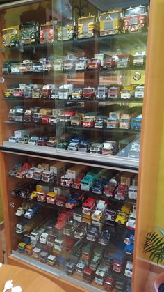 a display case filled with lots of toy cars