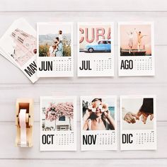 calendars with photos on them sitting next to a rubber stamp