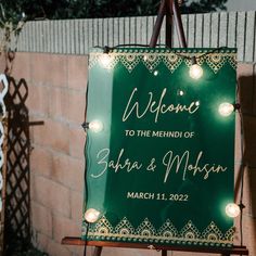 a welcome sign with lights on it in front of a brick wall that reads, welcome to the mind of sabra & mohsan march