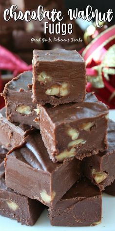 chocolate walnut fudge bars stacked on top of each other