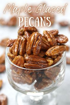 maple glazed pecans in a glass bowl with text overlay that reads maple glazed pecans