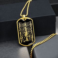 "This Nam Myoho Renge Kyo Necklace Is the Perfect Gift Whether for Yourself or a Loved One.  Explore all our Inspirational jewelry here: https://www.etsy.com/in-en/shop/SymbolicPresent?ref=seller-platform-mcnav§ion_id=31033166 ➜ Our jewelry is made of high-quality surgical steel with a shatterproof liquid glass coating and an 18k gold finish option. ➜ Engrave onto the back of the Nam Myoho Renge Kyo pendant your loved one's name, your wedding date, an anniversary, or anything else you want to re Nam Myoho Renge Kyo, Ganesh Pendant, Talisman Necklace, Inspirational Jewelry, Glass Coating, Gold Engraving, Mystery Book, Wedding Date, Tag Necklace