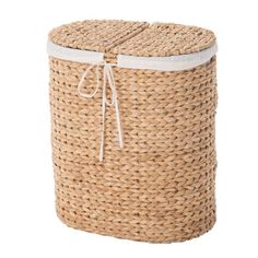 a large woven basket with white lining on the bottom and side, sitting in front of a