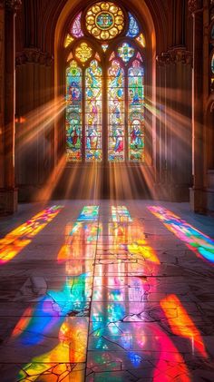 sunlight streaming through the stained glass windows in a cathedral