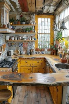 a kitchen with yellow cabinets and wooden counter tops in an old - fashioned style home