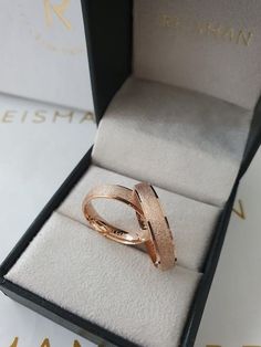 an open box with a ring inside it