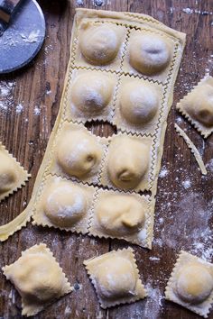 several ravioli shells on a wooden table