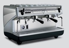 an espresso machine is shown on a gray background with buttons and dials