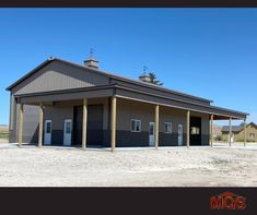 an empty building with two garages on each side